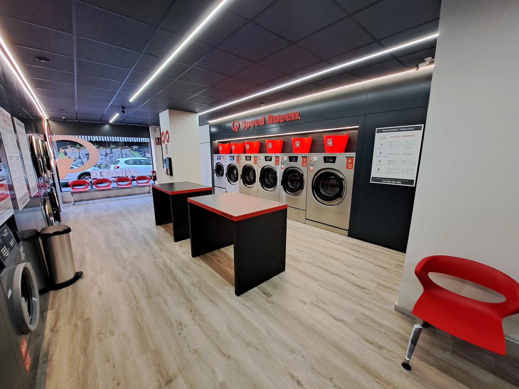 Inside a Gira Gira self-service laundromat in Madrid
