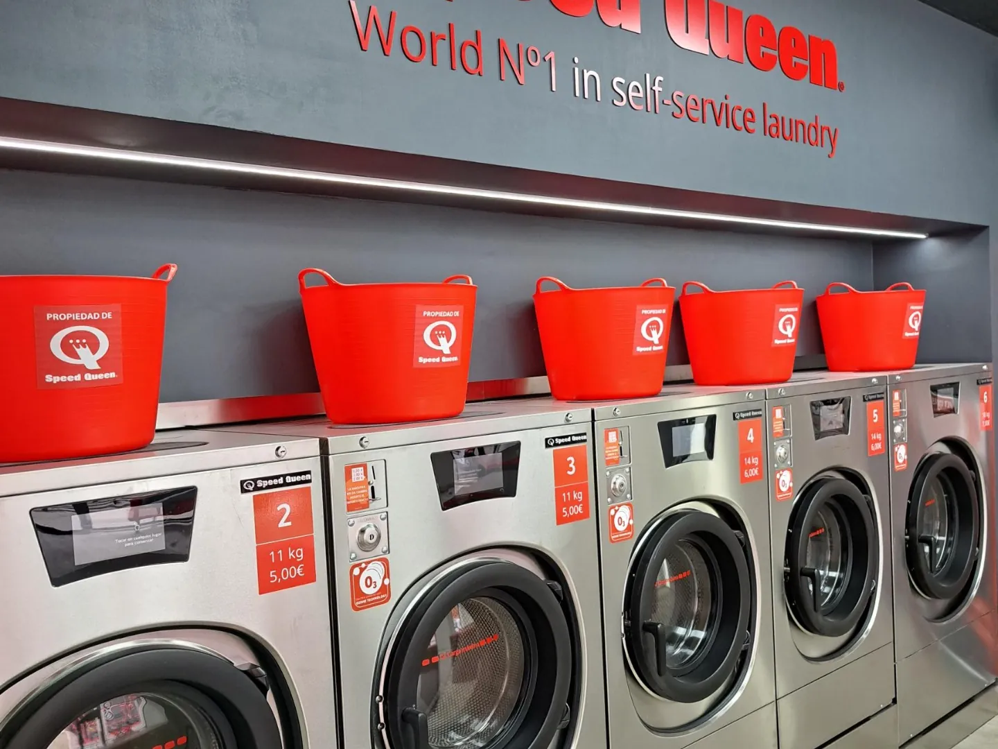 Speed Queen logo inside a Gira Gira laundromat
